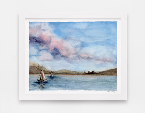 cotton candy skies with puffy clouds above a sailboat dotted lake watercolor landscape art print