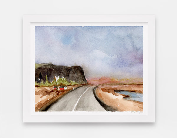 watercolor landscape art with two red houses on the side of an open road with a large cliffside looming to the left