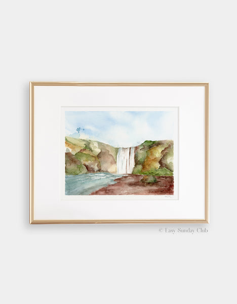 Gold framed mock up of giant waterfall in center of rocky green landscape watercolor