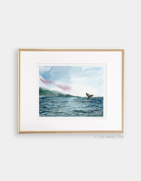 Gold framed mock up of velvet blue ocean ripples and gray whale tail in distance watercolor landscape