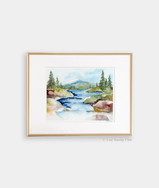 Gold framed mock up of rocky stream rolls down from a mountain tucked away in a forest watercolor landscape