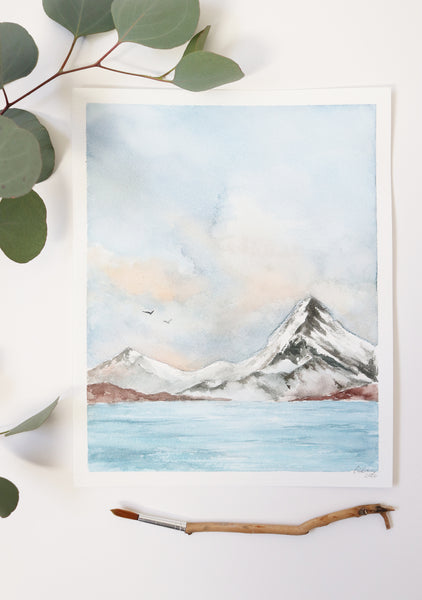 cold, bright lake with snowy mountain and cumulus clouds in watercolor