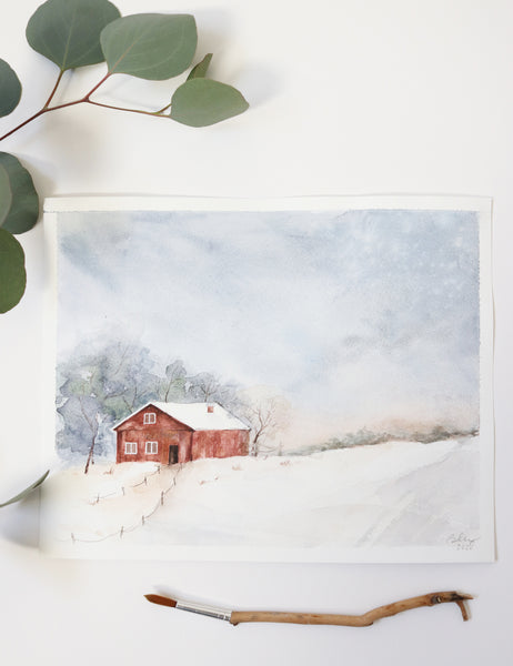 singular red barn in snowy field with ominous gray clouds above watercolor landscape flat lay