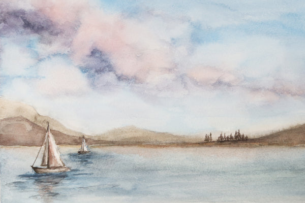 cotton candy skies with puffy clouds above a sailboat dotted lake watercolor landscape close up