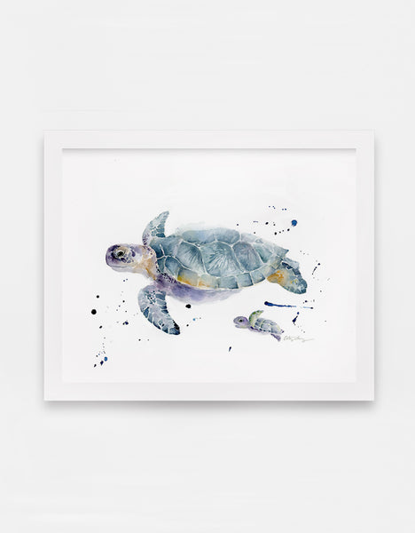 watercolor sea turtles art print showing one mother sea turtle swimming along with her baby sea turtle, framed in modern white frame.